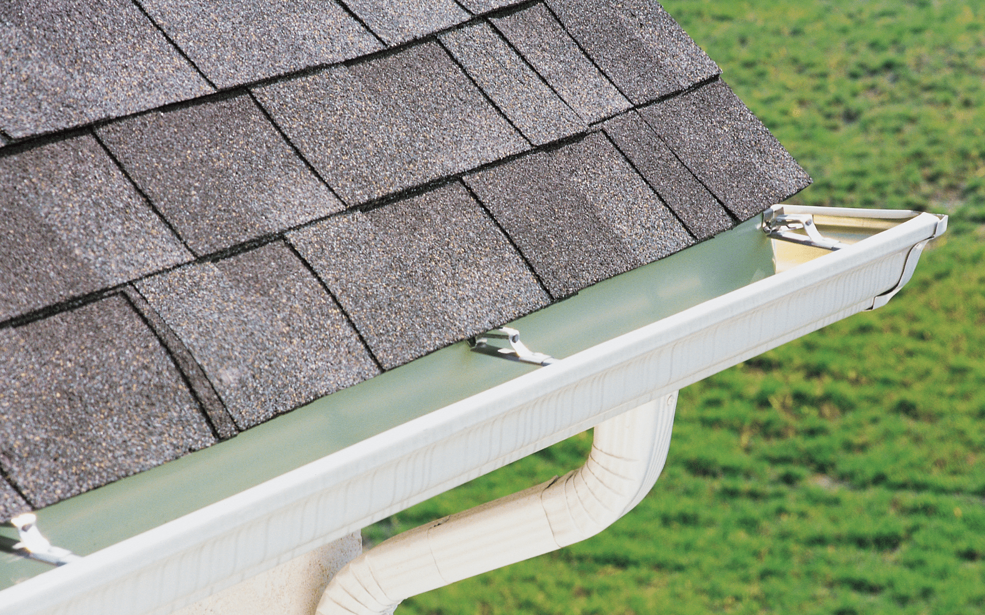 Residential gutter system with newly installed gutter guards beneath a roof with asphalt shingles, highlighting durable gutter replacements and protective solutions. Warminster PA 18974 (40.2061° N, 75.1077° W)
