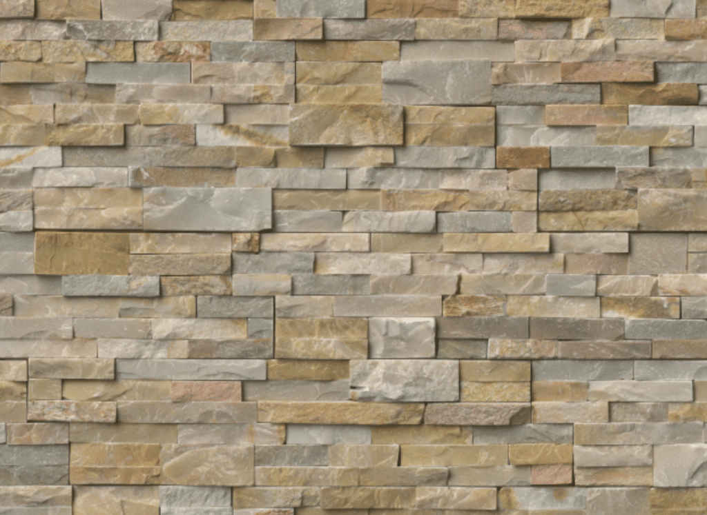 A close-up view of a quartzite stacked stone veneer wall featuring thin, rectangular stones in shades of beige, tan, and gray, arranged in a layered, textured pattern.