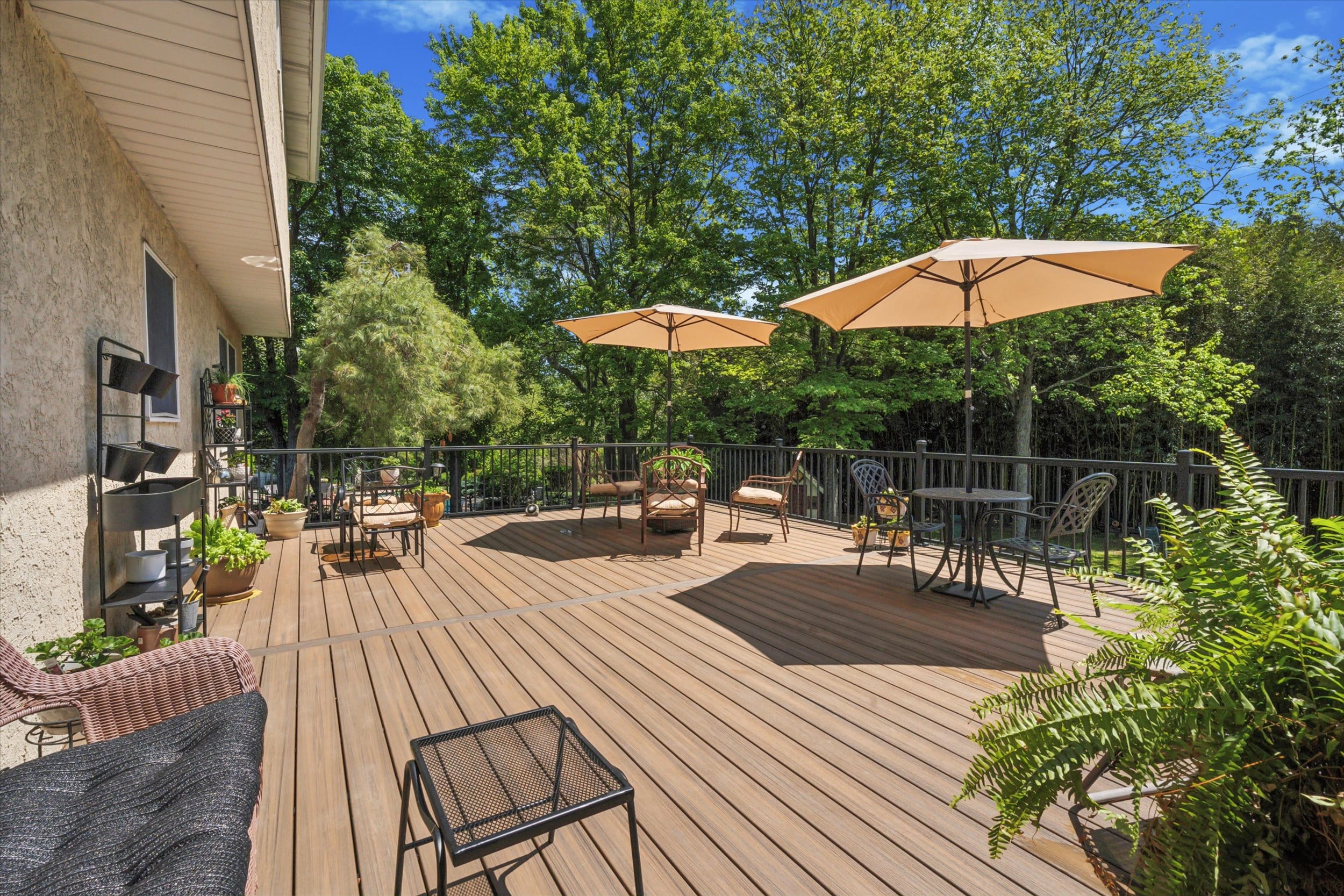 Newly built Trex composite deck with horizontal base skirting in Toasted Sand and Coastal Bluff colors