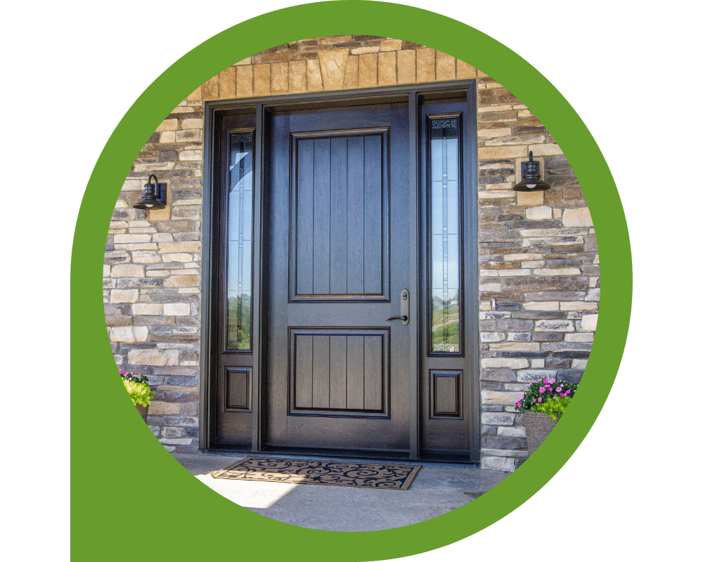 Modern black front entry door with sidelights and stone exterior facade.